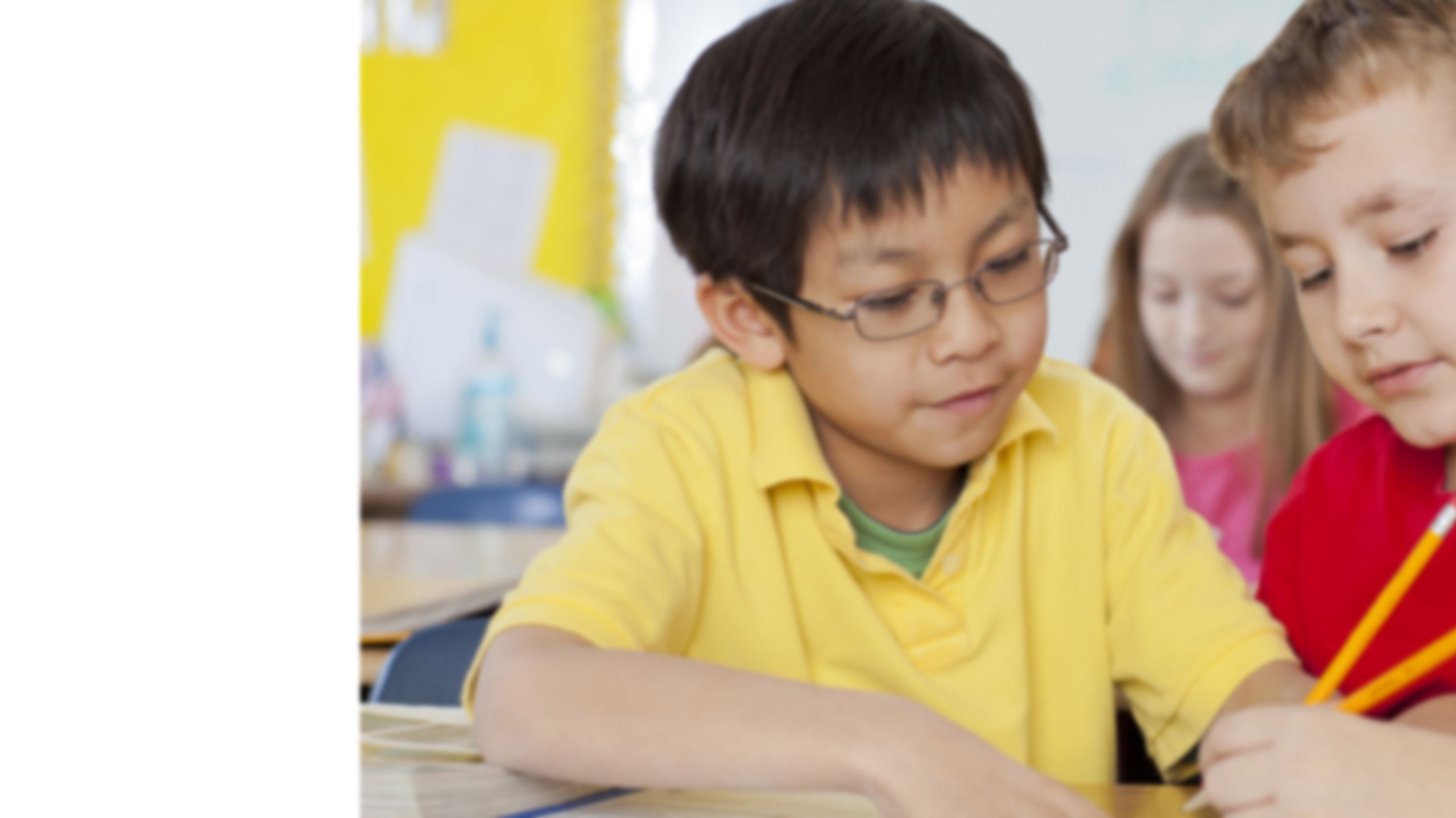 Image of two young boys working together.