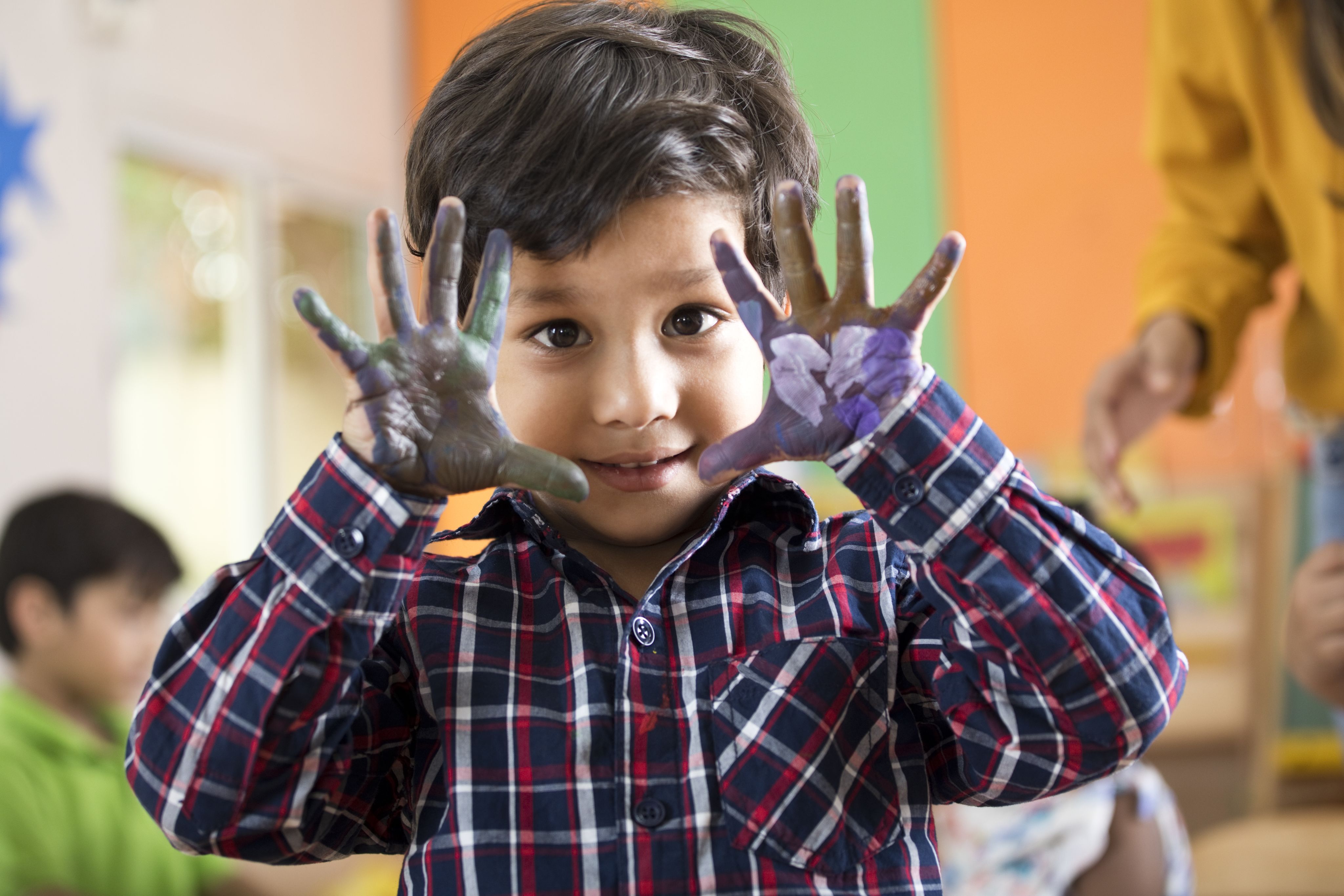 Boy with paint on his hands