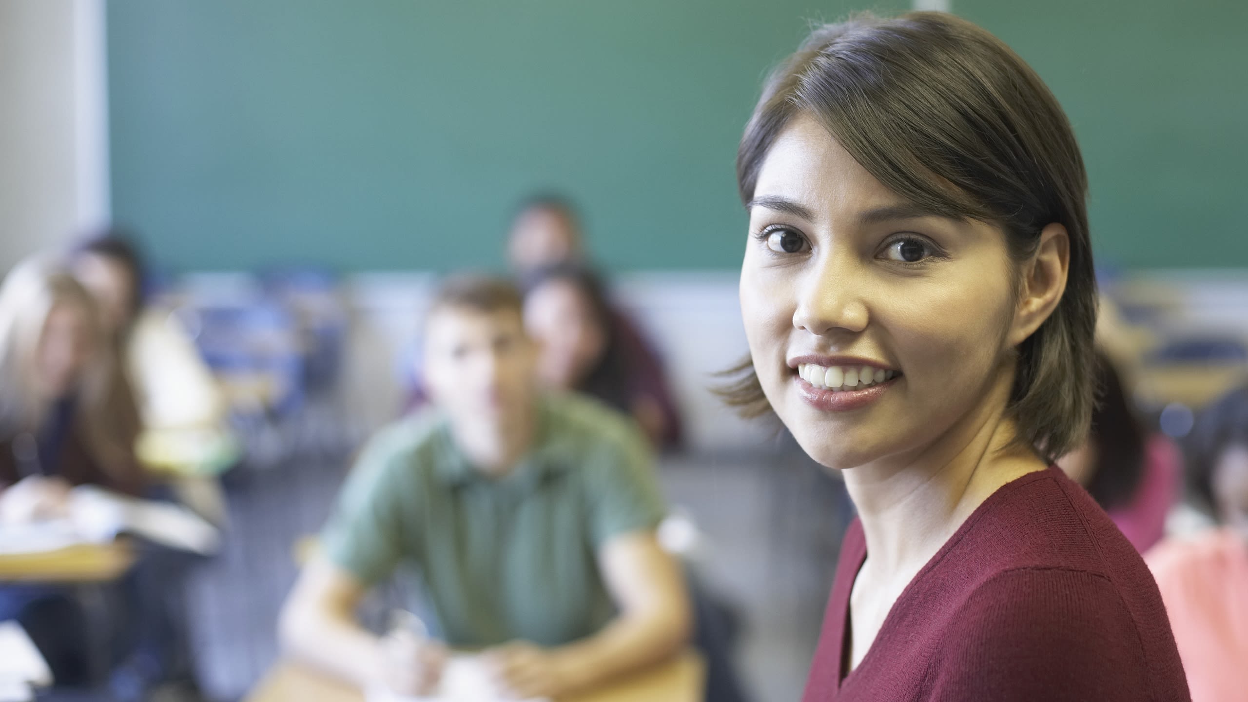 Young teacher smiling at the camera.